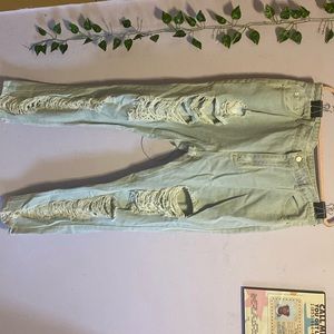 Distressed light blue jeans